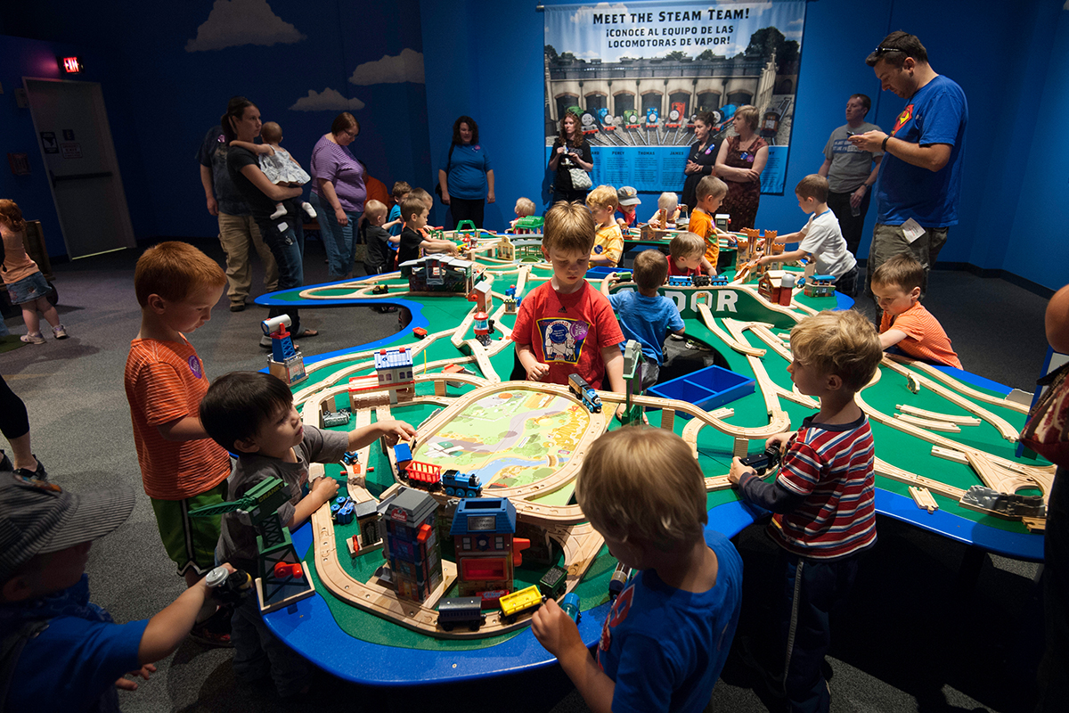 children playing with the train table